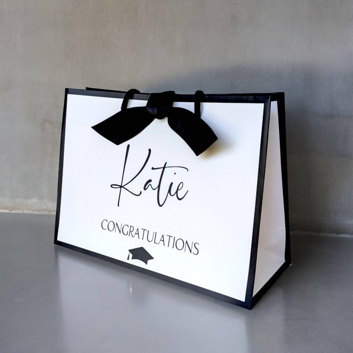 Personalised graduation gift bag medium white with black edge side view