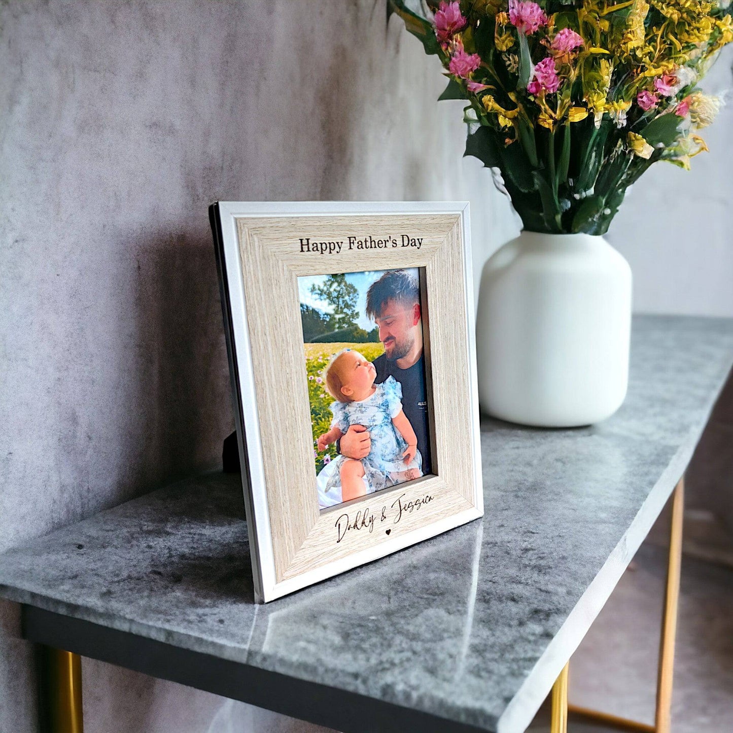 Wooden personalised fathers day picture frame on a table
