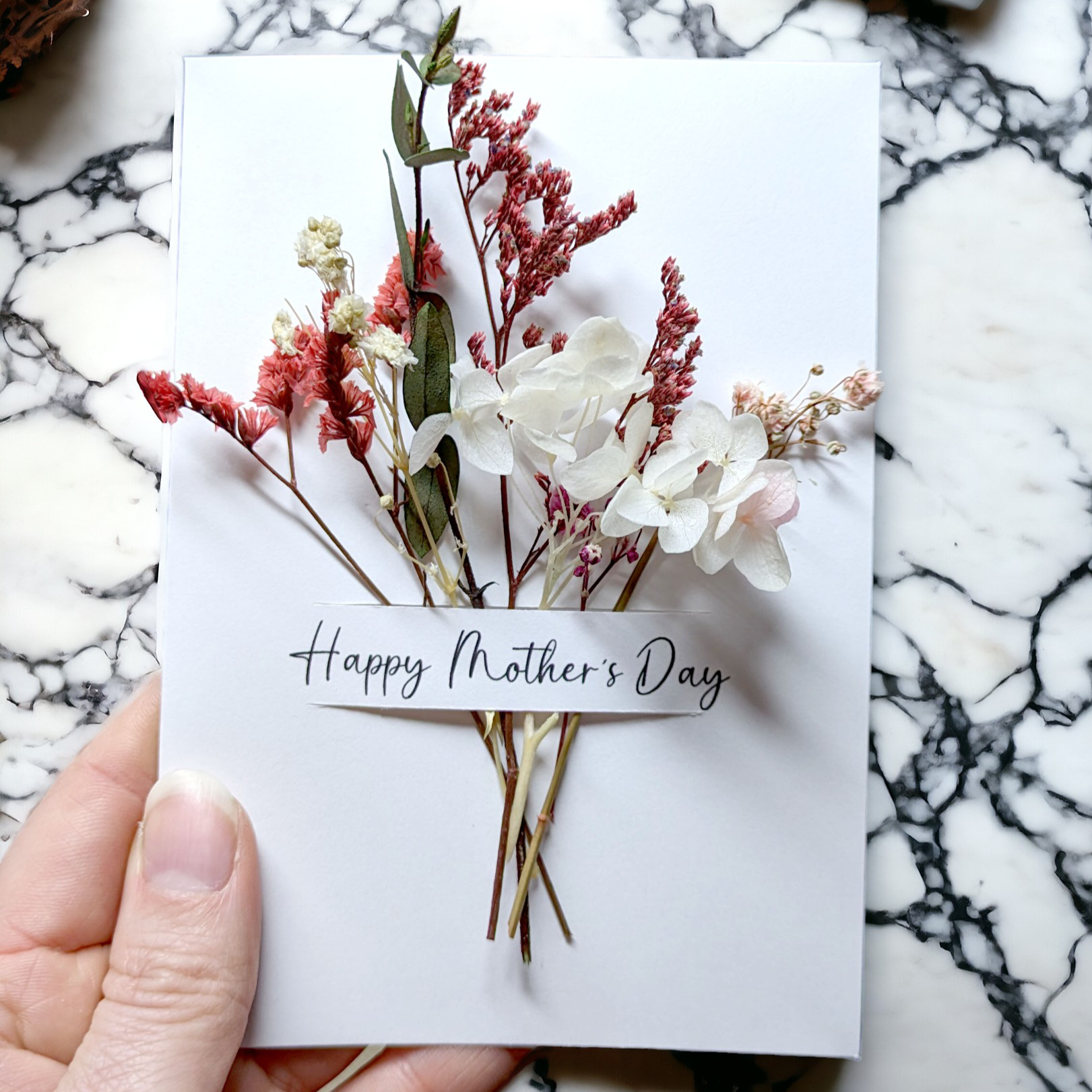 mothers day card with dried flowers held in hand