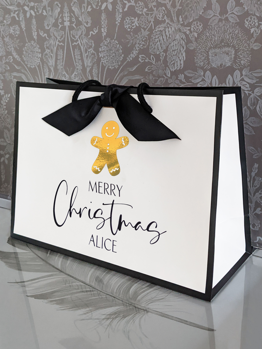 Personalised Christmas gift bag with name, chrome gold gingerbread man, side view