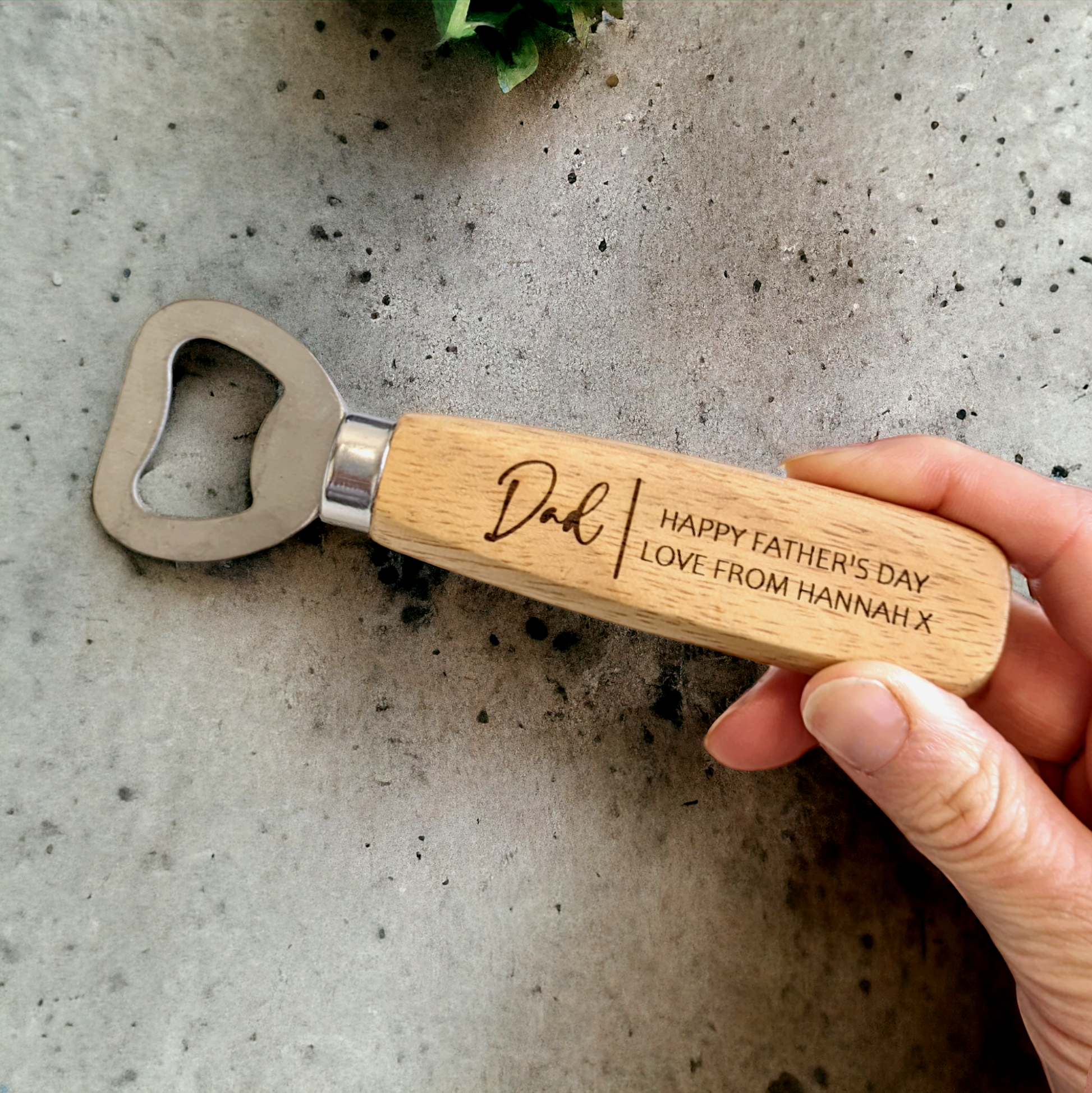 Father's day gift wooden bottle opener held in hand