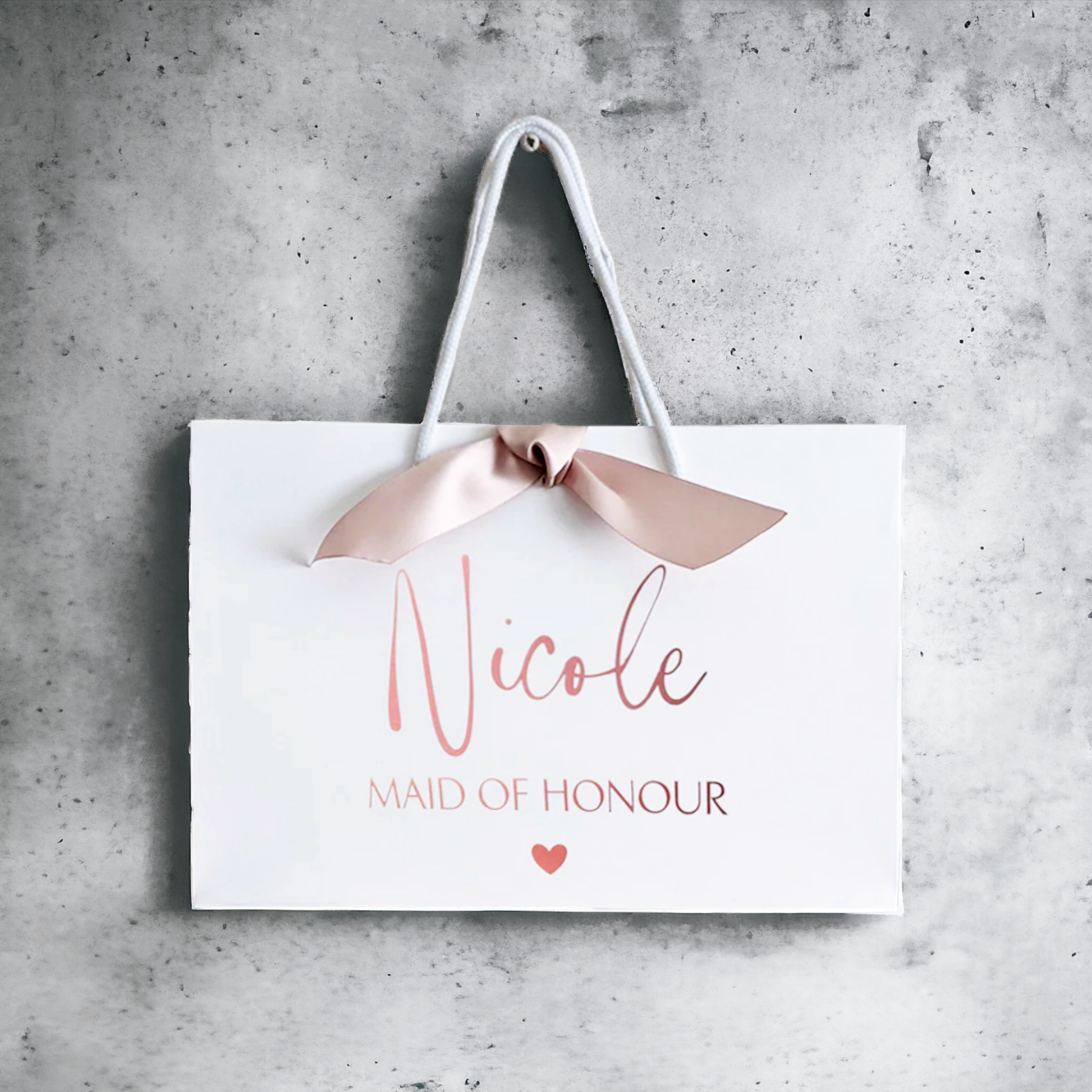 personalised bridesmaid gift bag rose gold with ribbon large bag on wall